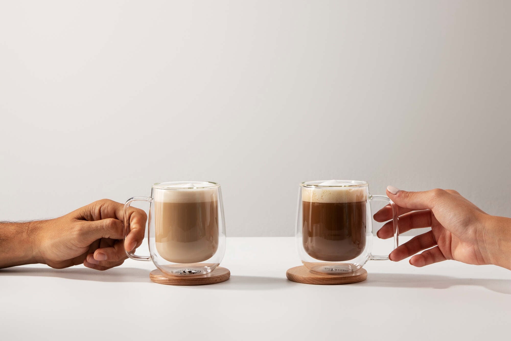 Comparison of traditional coffee and mushroom coffee in two glasses.
